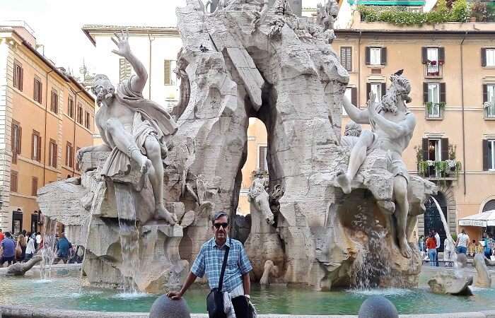Mr. Abhishek outside a fountain in Rome