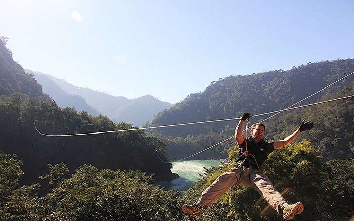 A person trying flying fox in Rishikesh