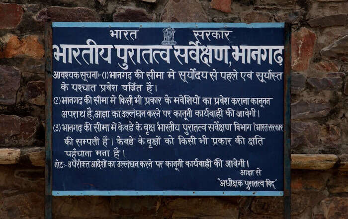 An ASI hoarding at Bhangarh fort - one of the most haunted places in India