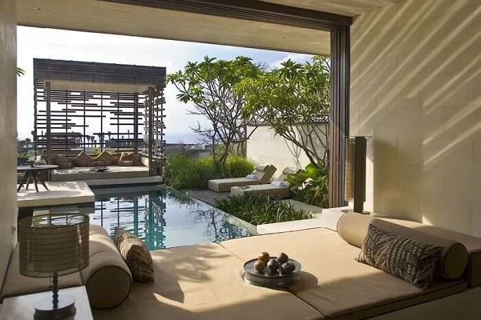 bedroom with stunning views of alila villas architecture