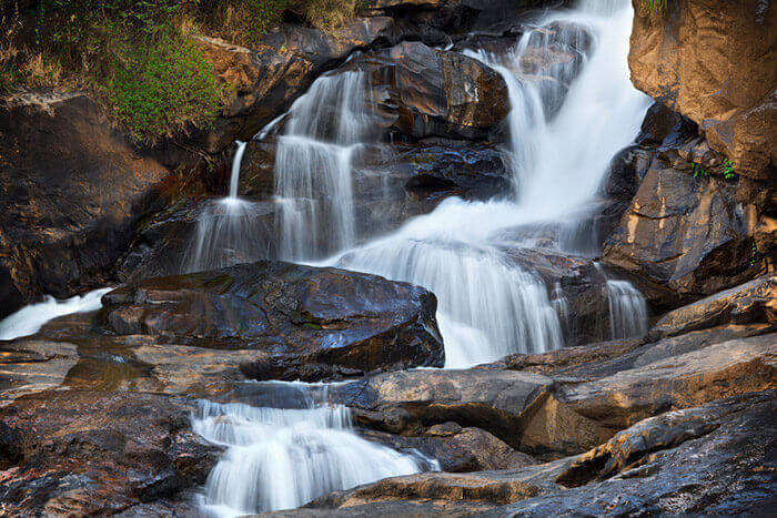 The mesmerisingly flowing Attukad falls in Munnar, one of the significant places to visit in Munnar