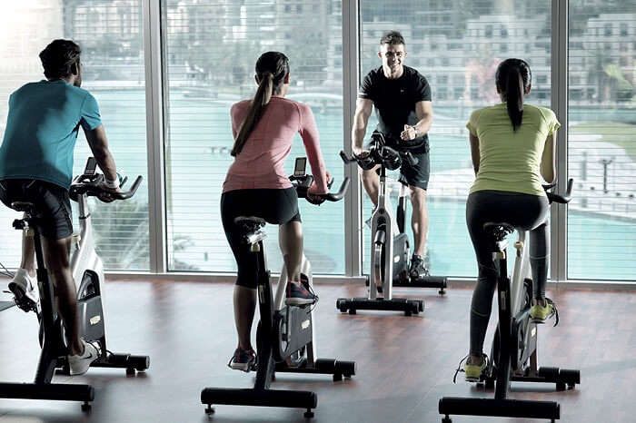 A gym trainer instructing the guests at the Burj Club Gym