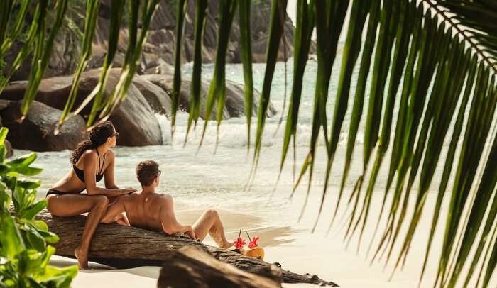 A couple having some quality time at a beautiful beach in Seychelles