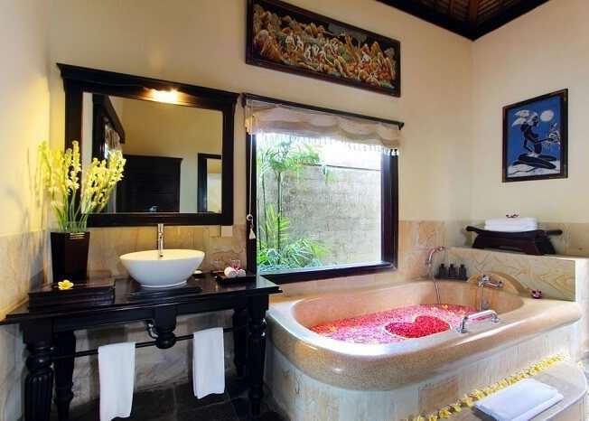 honeymoon suite's bathroom with bathtub in Furama Villas