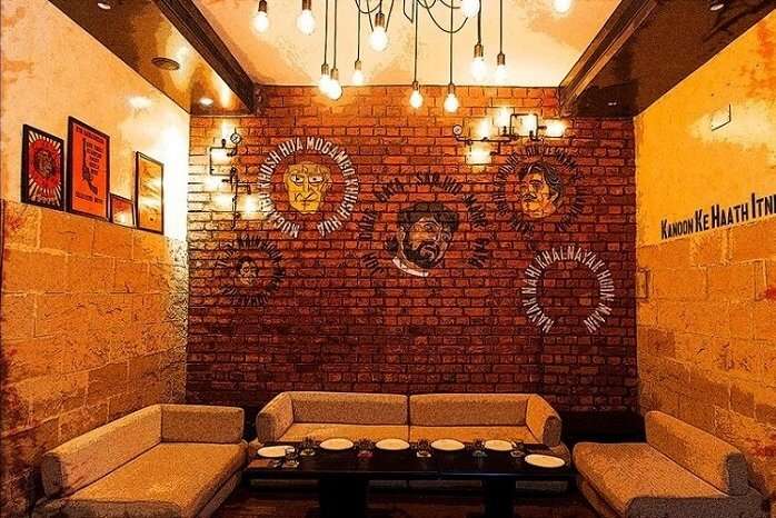 wall art and seating arrangement at Gabbar’s Bar and Kitchen