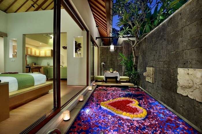 honeymoon suite with flower arrangement in ini vie villa