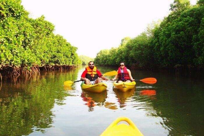 A couple kayaking in the backwaters of Goa