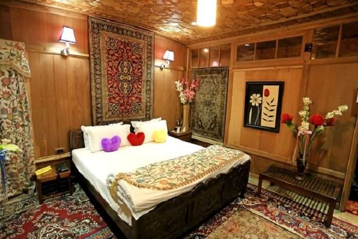 The palatial decor of Mughal Palace Houseboats make them popular choice for hotels in Srinagar near Dal Lake