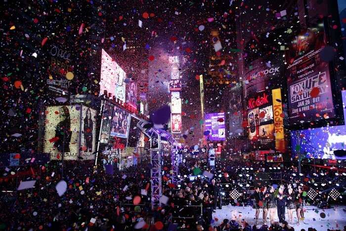 Confetti at Times Square soaks in the revellers during New Year Celebrations in New York
