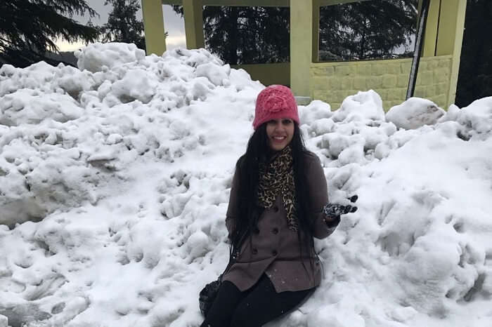 Girl enjoying snowfall in Dalhousie