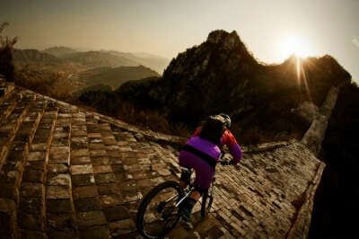 A rider attempting biking on The Great Wall of China