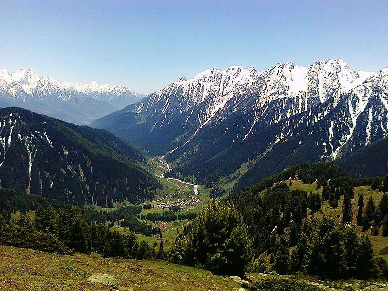 View_of_Aru_Village_enclosed_by_snow_clad_mountains_from_top_of_Birzamal