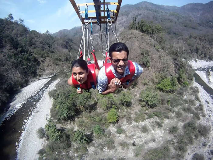 A couple celebrating Valentine’s Day by engaging in adventure activities like flying fox at Rishikesh