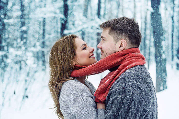 A couple getting cosy in the snow at Srinagar