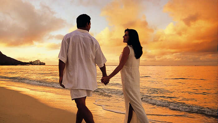 A couple strolling on the beach at sunset at Havelock, Andaman, one of the great places for Valentine’s Day