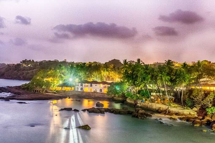 A sunset view of a bungalow at the Dona Paula Beach in Goa