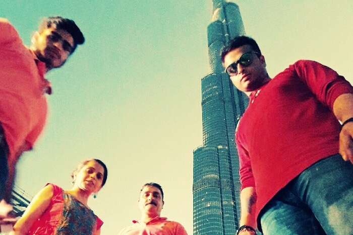 me and my family standing below burj khalifa
