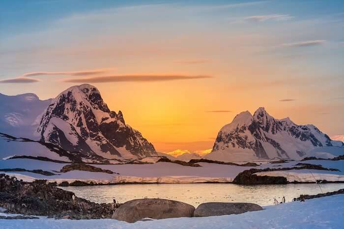 Beautiful snow-capped mountains against the sunset sky in Antarctica