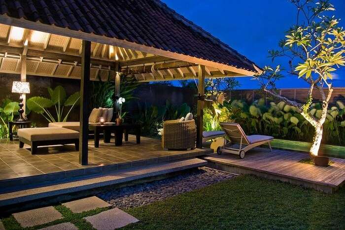 open lounge area with recliners near private pool in villa komea