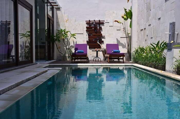 reclining chairs near private pool of zoe villa