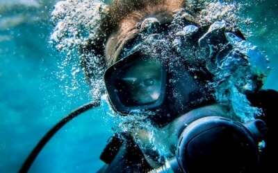 Scuba divers blowing bubbles