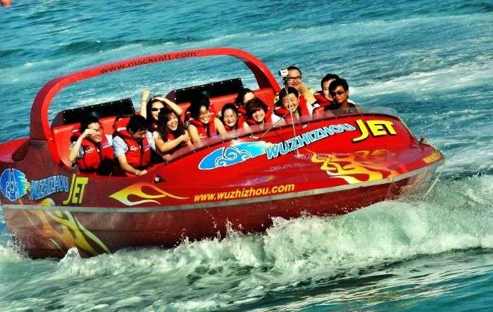 Tourists ride speed boat near Wuzhizhou Island in Sanya, China