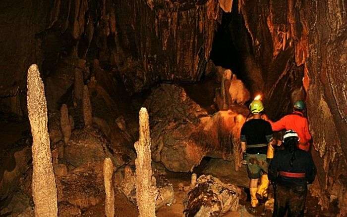 Tourists exploring cave in Meghalaya