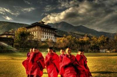 Monks in front of Gangtey Monastery in Bhutan