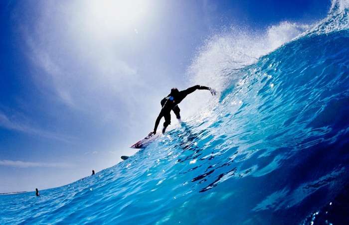 Surfing along the azure waters of the Indian Ocea, Arugam Bay
