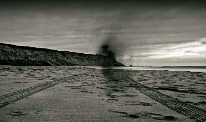 An incredible shot of black sands and a ghostly figure on the Dumas beach