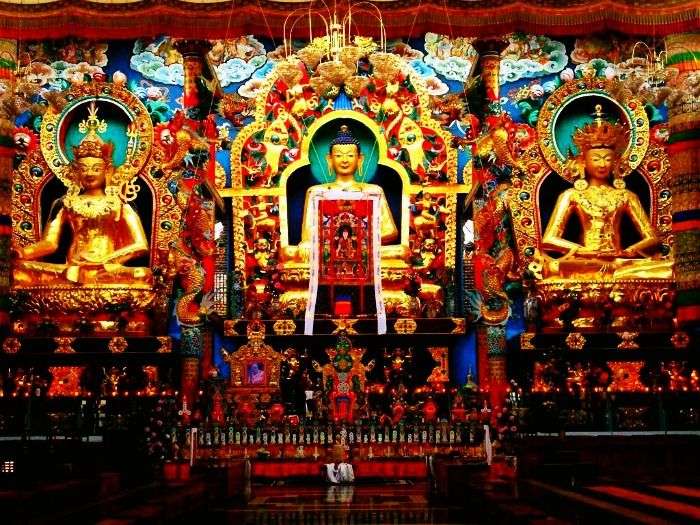 Golden statues in Golden Temple Complex in Coorg