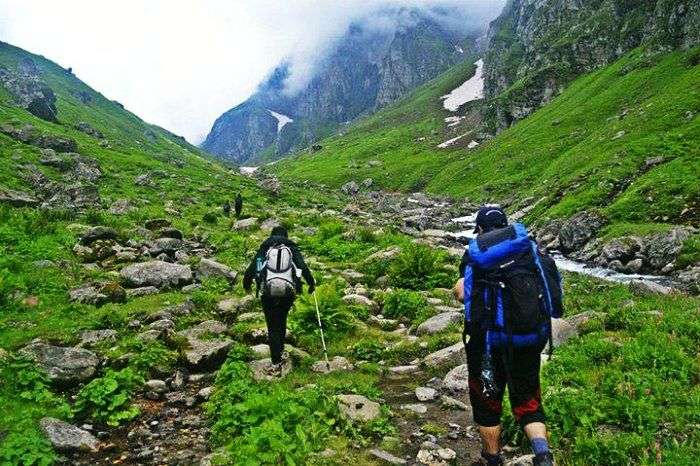 Trekkers hiking through the trails of Hampta Pass