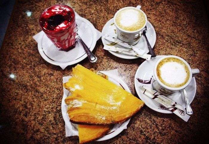 Sugar topped pastry of custard along with Portuguese cappuccino makes for a wonderfully tasty breakfast.