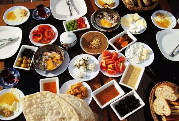 Jam, sausage, Turkish Tea, veggies and salads make for a healthy Turkish breakfast
