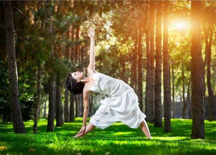 A girl practising yoga at Ayurveda Yoga Meditation Resort in Coonoor one of the best yoga retreats in India