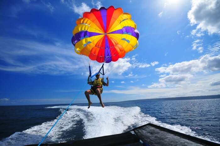 A man parasailing in the waters of Andaman