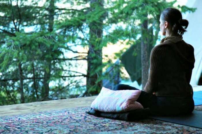 A lady meditating at the Tushita meditation centre in Dharamshala