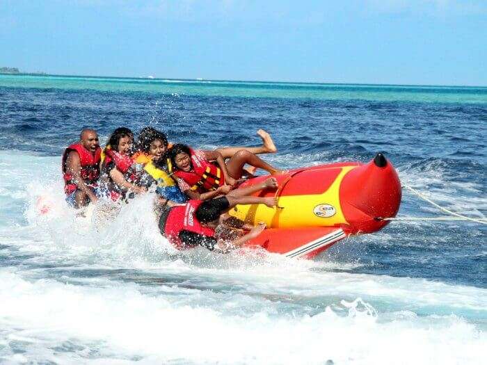 A group of people enjoying a ride on a banana boat in Andaman