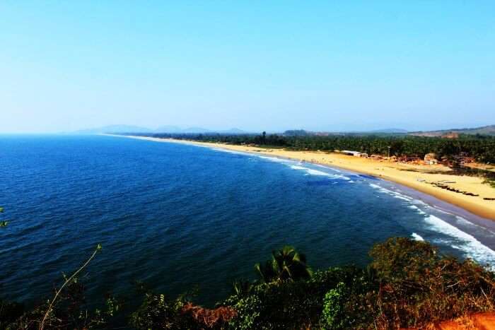 The crescent shaped Half Moon beach in Gokarna