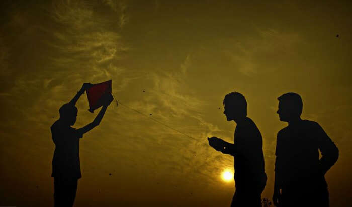 Young people flying kite in Ahmedabad