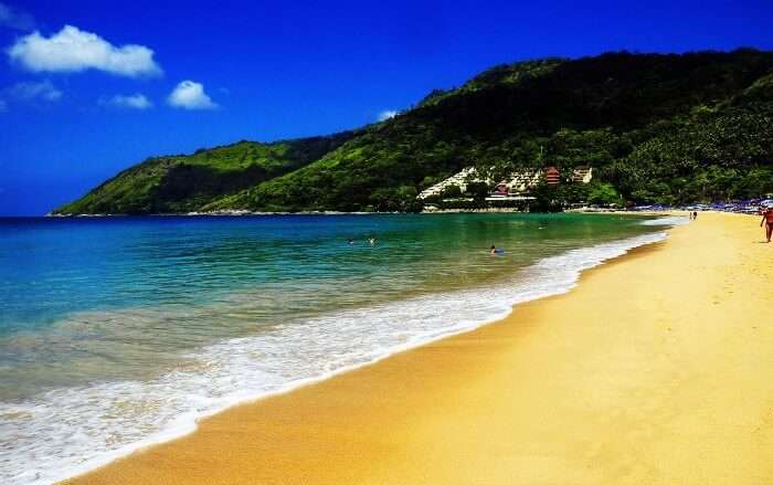 The pristine shores and azure waters of Nai Harn make it one of the best beaches of Thailand to walk barefoot