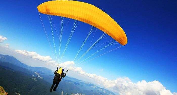 A paraglider in the beautiful valley of Manali