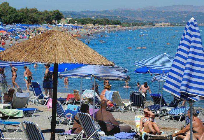 People enjoying at a beach in Greece