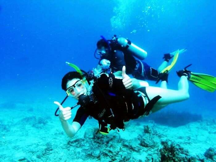 A woman scuba diving in Goa