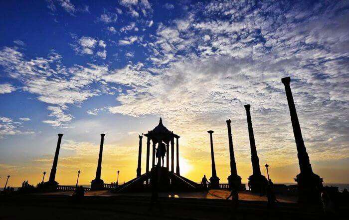 The sunrise looks magnificent in the backdrop of the Gandhi statue at the Promenade beach