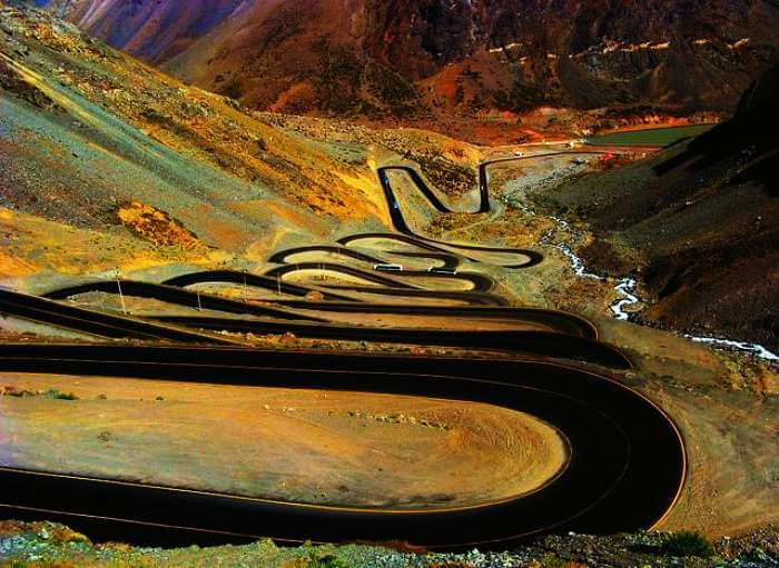 An aerial view of the hairpin bends of The Caracoles, Chile