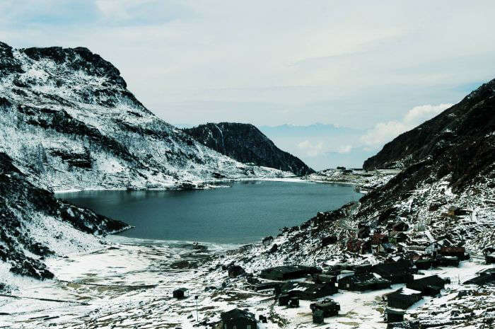 Snow covered peaks surrounding the Tsomgo Lake