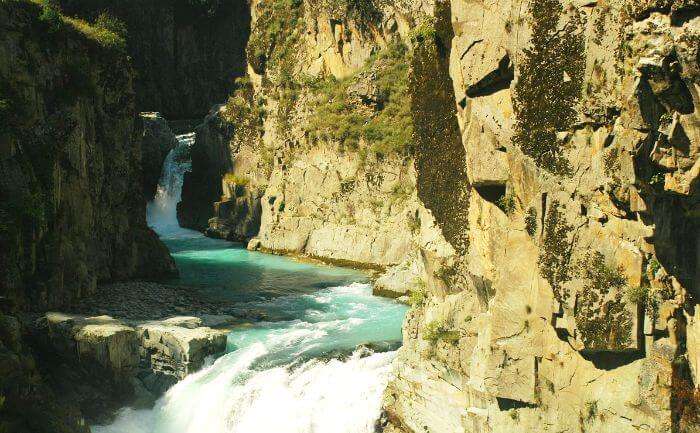 The sun kissed Aharbal waterfall in Kulgam in autumn season