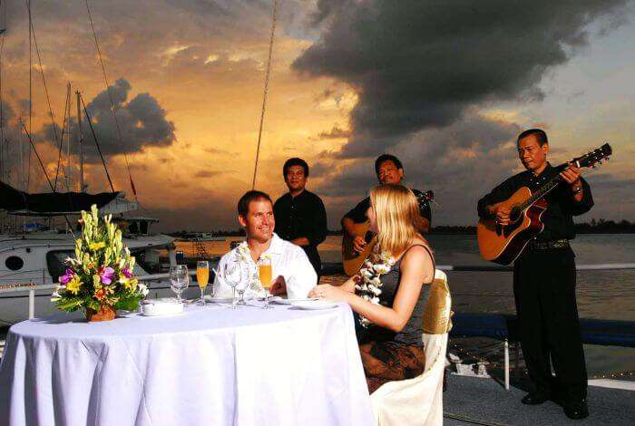 A couple dining at the Bali Hai cruise