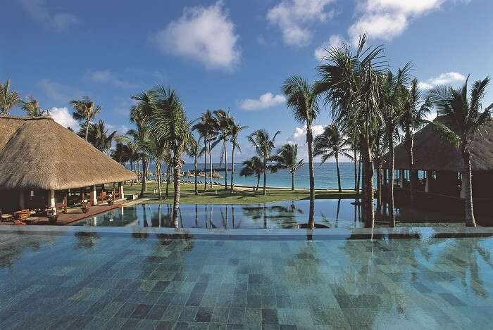 View of serene water villas at Belle Mare Plage - one of the best beach places in visit in Mauritius